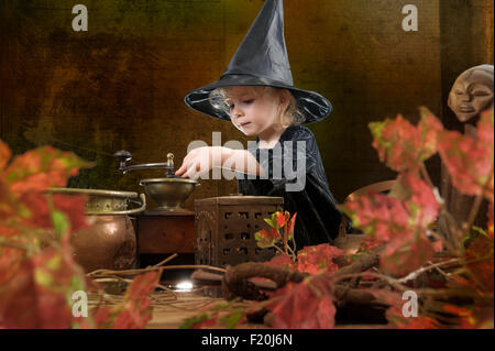 little halloween witch with cauldron Stock Photo