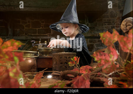 little halloween witch with cauldron Stock Photo