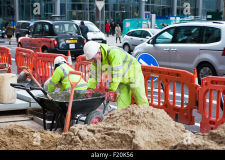 LONDON - OCTOBER 15TH: Unidentified workman  changing the pavement near Liverpool Street on October 15th, 2015 in London, Englan Stock Photo