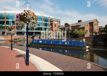 The Barclaycard Arena (National Indoor Arena) and The Malt House pub on the Birmingham Canal Old Line, Birmingham, West Midlands Stock Photo