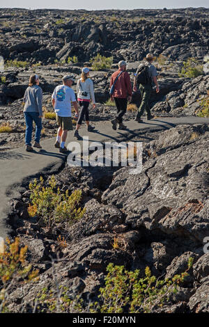 Arco, Idaho - A park ranger leads visitors on a walking tour of the cave area at Craters of the Moon National Monument. Stock Photo