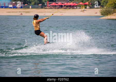 Young girl wakeboarder in action on the lake Stock Photo