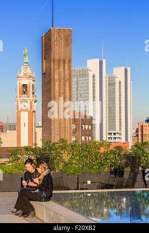 Italy, Lombardy, Milan, 7 Ceresio, restaurant with rooftop pool, designed by the architectural firm Studio Dimore with basically the campanile of Saint Anthony of Padua Church Stock Photo