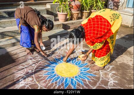 India, Tamil Nadu state, Madurai, sand drawing done in front of houses for the harvest festival of Pongal Stock Photo