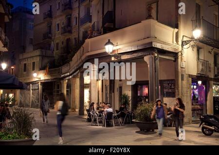 Spain, Catalonia, Barcelona, Born area, also known as La Ribera, The old Born Market nowadays become a cultural center El Born Centre Cultural, People enjoying a drink on Passeig del Born in front of the Old market Stock Photo