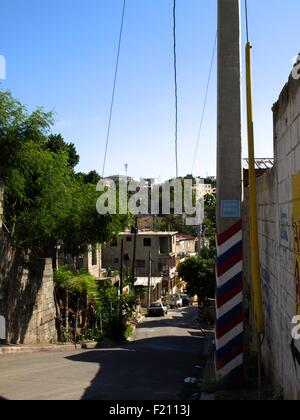 A street in a poor neighborhood in the capital city Santo Domingo. Stock Photo