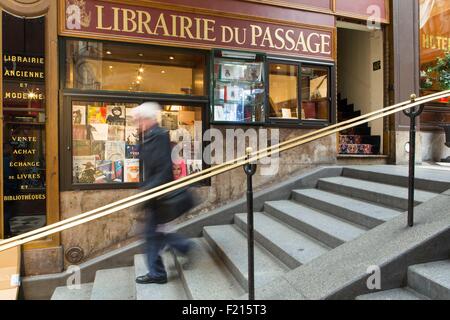 France, Paris, Passage Jouffroy, people strolling by the shop window of Librairie du Passage (Passage bookstore) Stock Photo