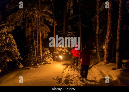 Canada, Quebec province, Eastern Townships or Estrie, Parc national du Mont Megantic, the Astrolab, snowshoe hiking in the light of torches Stock Photo