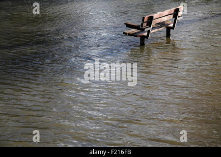 Climate, Weather, Flooding, Bench in flooded public park. Stock Photo