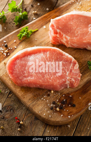Raw Organic Boneless Pork Chops Ready to Cook Stock Photo