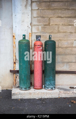 Three old rusty gas bottles Stock Photo