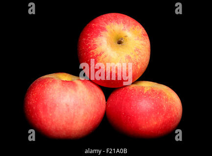 Three red apples on black background Stock Photo