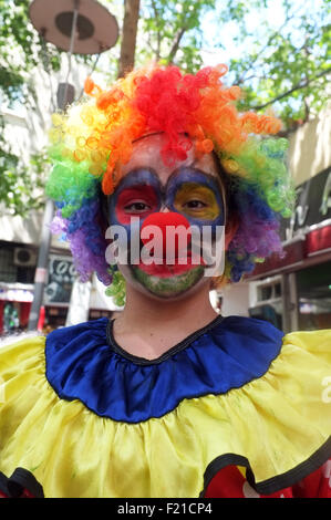 Female seller in clown dress Stock Photo