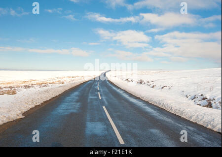 Country road going into distance through english rural winter scene Stock Photo