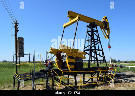 Pumping unit as the oil pump installed on a well Stock Photo