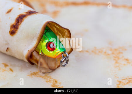 front a fishing tackle lure rolled in pancake Stock Photo