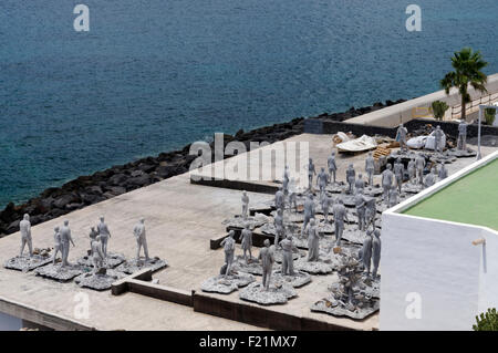 Figures of people made from concrete, Rubicon Marina, Playa Blanca, Lanzarote, Canary Islands, Spain. Stock Photo