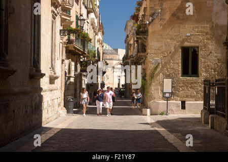 Sunlit back-street in town of Lecce Apulia Italy Stock Photo