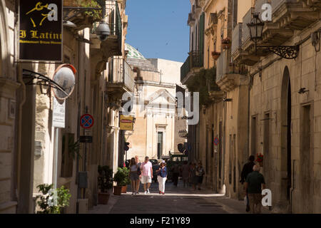 Sunlit back-street in town of Lecce Apulia Italy Stock Photo