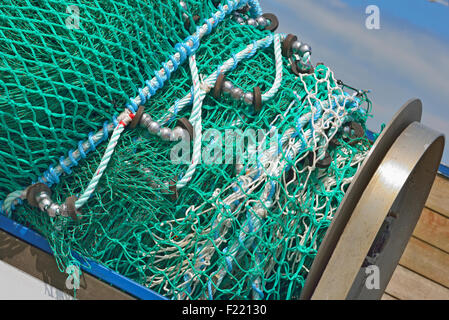a pile of fishing nets in harbor Stock Photo