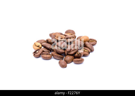 Grains of organic coffee from close range. Isolated on white background. Stock Photo