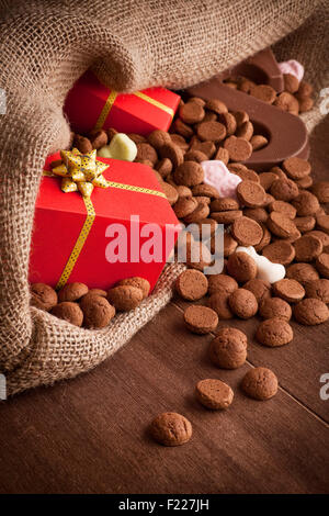 'De zak van Sinterklaas' (St. Nicholas' bag) filled with 'pepernoten', a letter of chocolate and sweets. All part of the traditi Stock Photo