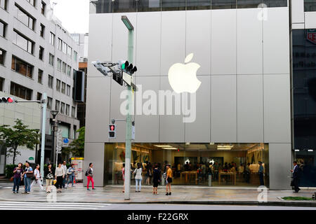 Pedestrians walk past the Apple Store in Ginza on September 10, 2015, Tokyo, Japan. Even after Apple CEO Tim Cook announced their new products iPad Pro, iPhone 6s, iPhone 6s Plus and Apple TV on September 9, 2015, hardcore Japanese fans were nowhere to be seen outside the principal stores in Ginza and Omotesando. This could be because of heavy rain that hit Japan this week caused by typhoon Etau, or perhaps Apple fans are now less excited by this clockwork new release cycle. In Australia the media already reported that the first Apple fan had set up a tent in front of the store in Sydney. (Pho Stock Photo