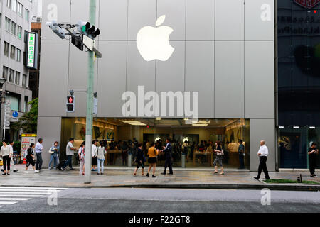 Pedestrians walk past the Apple Store in Ginza on September 10, 2015, Tokyo, Japan. Even after Apple CEO Tim Cook announced their new products iPad Pro, iPhone 6s, iPhone 6s Plus and Apple TV on September 9, 2015, hardcore Japanese fans were nowhere to be seen outside the principal stores in Ginza and Omotesando. This could be because of heavy rain that hit Japan this week caused by typhoon Etau, or perhaps Apple fans are now less excited by this clockwork new release cycle. In Australia the media already reported that the first Apple fan had set up a tent in front of the store in Sydney. (Pho Stock Photo