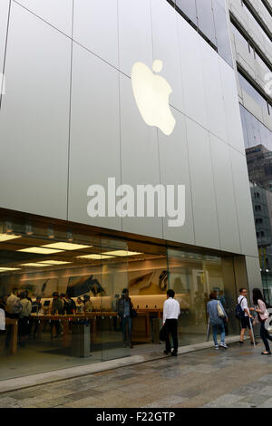 Pedestrians walk past the Apple Store in Ginza on September 10, 2015, Tokyo, Japan. Even after Apple CEO Tim Cook announced their new products iPad Pro, iPhone 6s, iPhone 6s Plus and Apple TV on September 9, 2015, hardcore Japanese fans were nowhere to be seen outside the principal stores in Ginza and Omotesando. This could be because of heavy rain that hit Japan this week caused by typhoon Etau, or perhaps Apple fans are now less excited by this clockwork new release cycle. In Australia the media already reported that the first Apple fan had set up a tent in front of the store in Sydney. (Pho Stock Photo