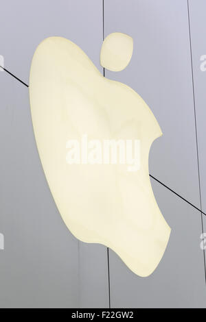 Apple's sign on display outside its store in Ginza on September 10, 2015, Tokyo, Japan. Even after Apple CEO Tim Cook announced their new products iPad Pro, iPhone 6s, iPhone 6s Plus and Apple TV on September 9, 2015, hardcore Japanese fans were nowhere to be seen outside the principal stores in Ginza and Omotesando. This could be because of heavy rain that hit Japan this week caused by typhoon Etau, or perhaps Apple fans are now less excited by this clockwork new release cycle. In Australia the media already reported that the first Apple fan had set up a tent in front of the store in Sydney. Stock Photo