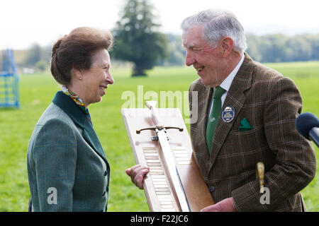 Courance, Moffat, Scotland, UK. 10th September, 2015. The Princess Royal visits the 2015 International Sheep Dog Trials and chats to local farmer Alasdair Mundell, winner of the Wilkinson Sword for services to the Sheep Dog World. Credit:  Michael Buddle/Alamy Live News Stock Photo