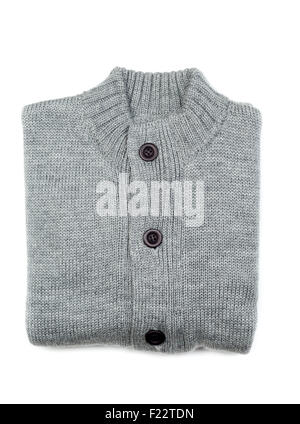 Grey knit sweaters folded on white background. Stock Photo