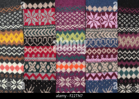 Dark knitted background with the national winter pattern. Stock Photo