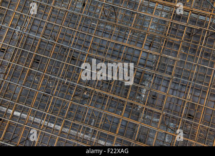 Steel bars reinforcement on construction site, top view, editable background. Formwork used for concrete layering. Stock Photo