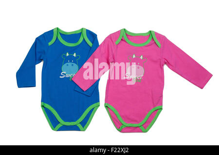 Two blue and pink baby clothes with print hippopotamus. Isolate on white. Stock Photo