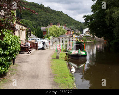 Towpath and Hebden Bridge Cruises Narrowboat on the Rochdale Canal at Stubbing Wharf Hebden Bridge West Yorkshire England Stock Photo