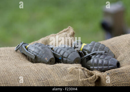 World War 2 American Hand Grenades on a burlap sack Stock Photo