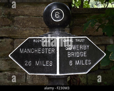 Manchester and Sowerby Bridge Signpost on the Rochdale Canal near Hebden Bridge West Yorkshire England Stock Photo