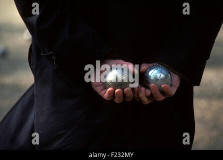 Petanque ball boules bowls on a dust floor, photo in impact. Game of  petanque on the ground. Balls and a small wood jack Stock Photo