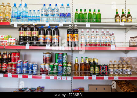 Showcase with different beverages at the grocery store in Russian village Stock Photo