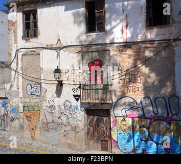 Graffiti in Granada Spain spanish street art painting slum housing derelict property dilapidated decaying neglected Stock Photo