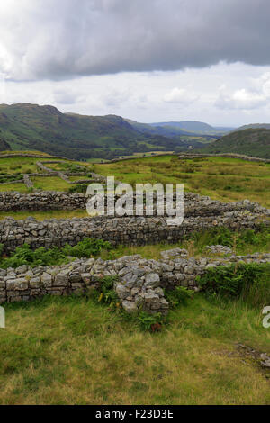 Stormy sky over the remains of Hardknott Roman Fort Mediobogdum, Cumbria, Lake District National Park, England, UK. Stock Photo