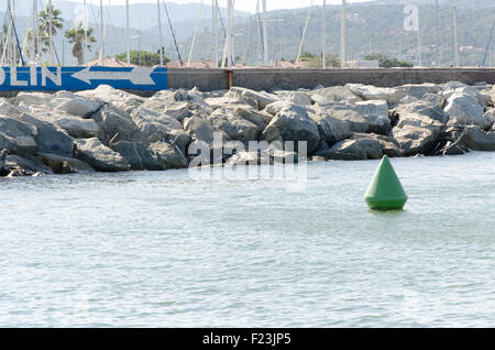 A green buoy floating on a sea Stock Photo