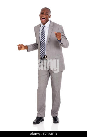 excited young African businessman dancing over white background Stock Photo