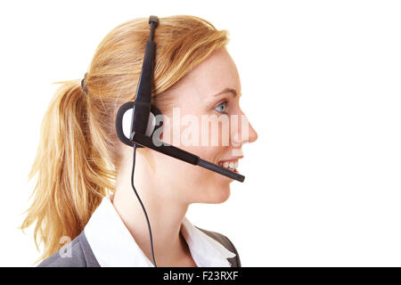 Happy blond business woman using a headset Stock Photo