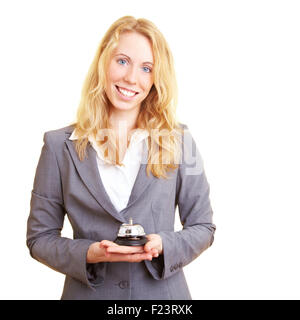 Woman in a business suit with hotel bell Stock Photo