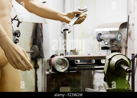 A mannequin in a machine shop Stock Photo