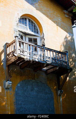 Wooden balcony in a old house Stock Photo