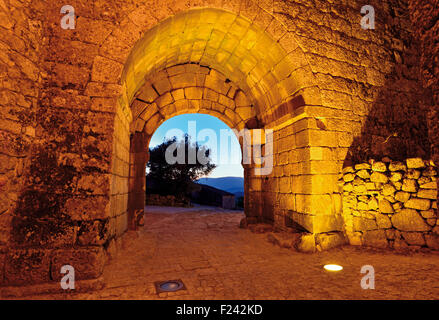Portugal: Nocturnal illuminated medieval gateway of the historic village Sortelha Stock Photo