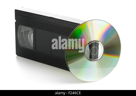 Analog video cassette with DVD disc - old movies backup or transfer concept Stock Photo